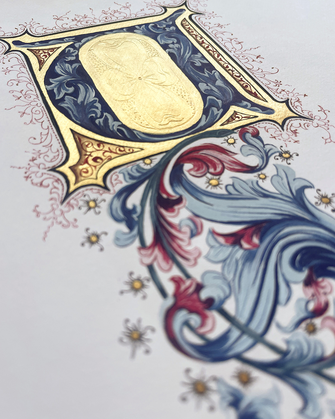 Gilded U with acanthus leaves in blue and red by Katie Leavens