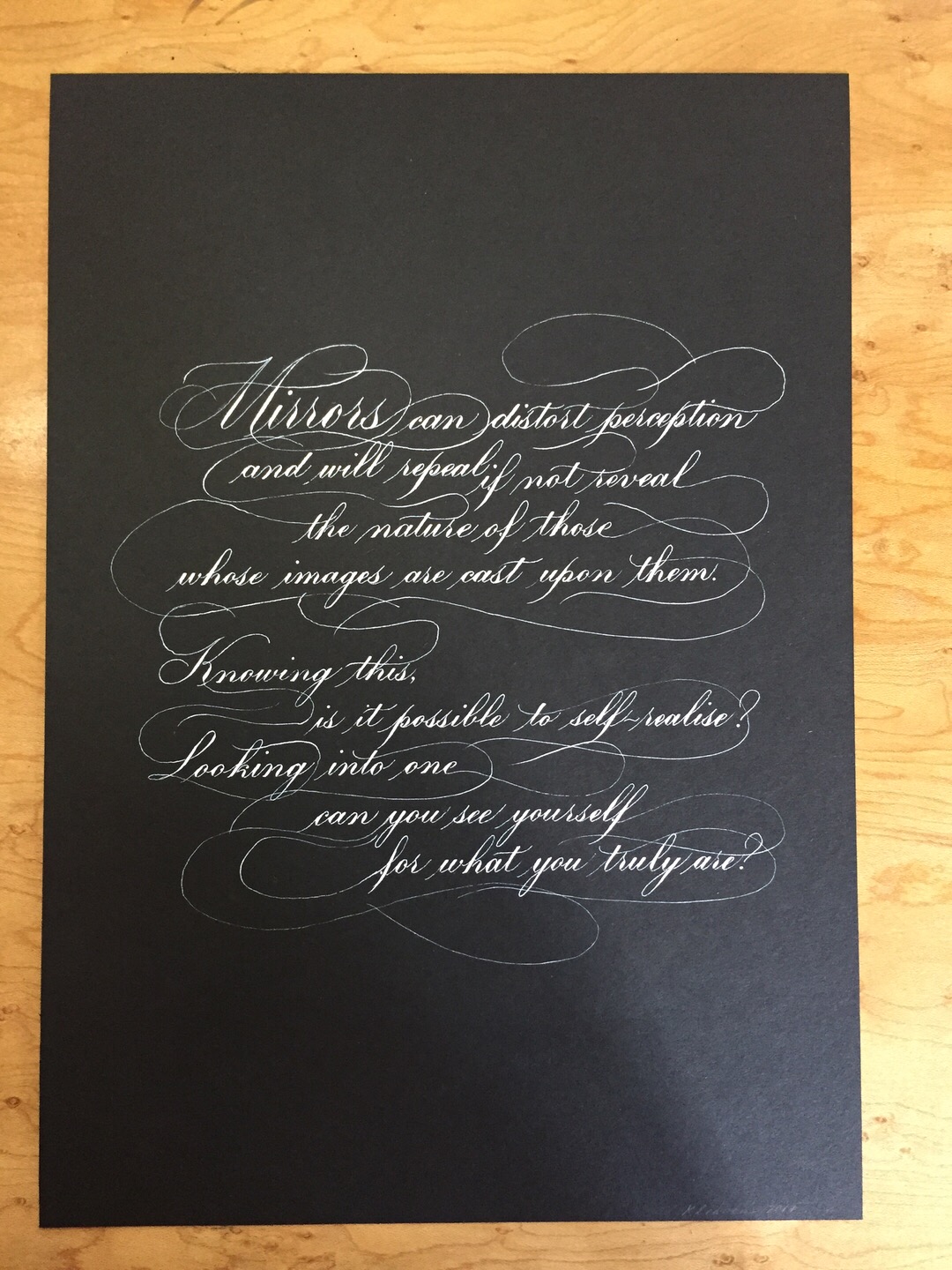 Calligraphic quote white on black