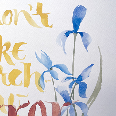 watercolor painting of a blue iris with yellow and red calligraphic brush lettering to left